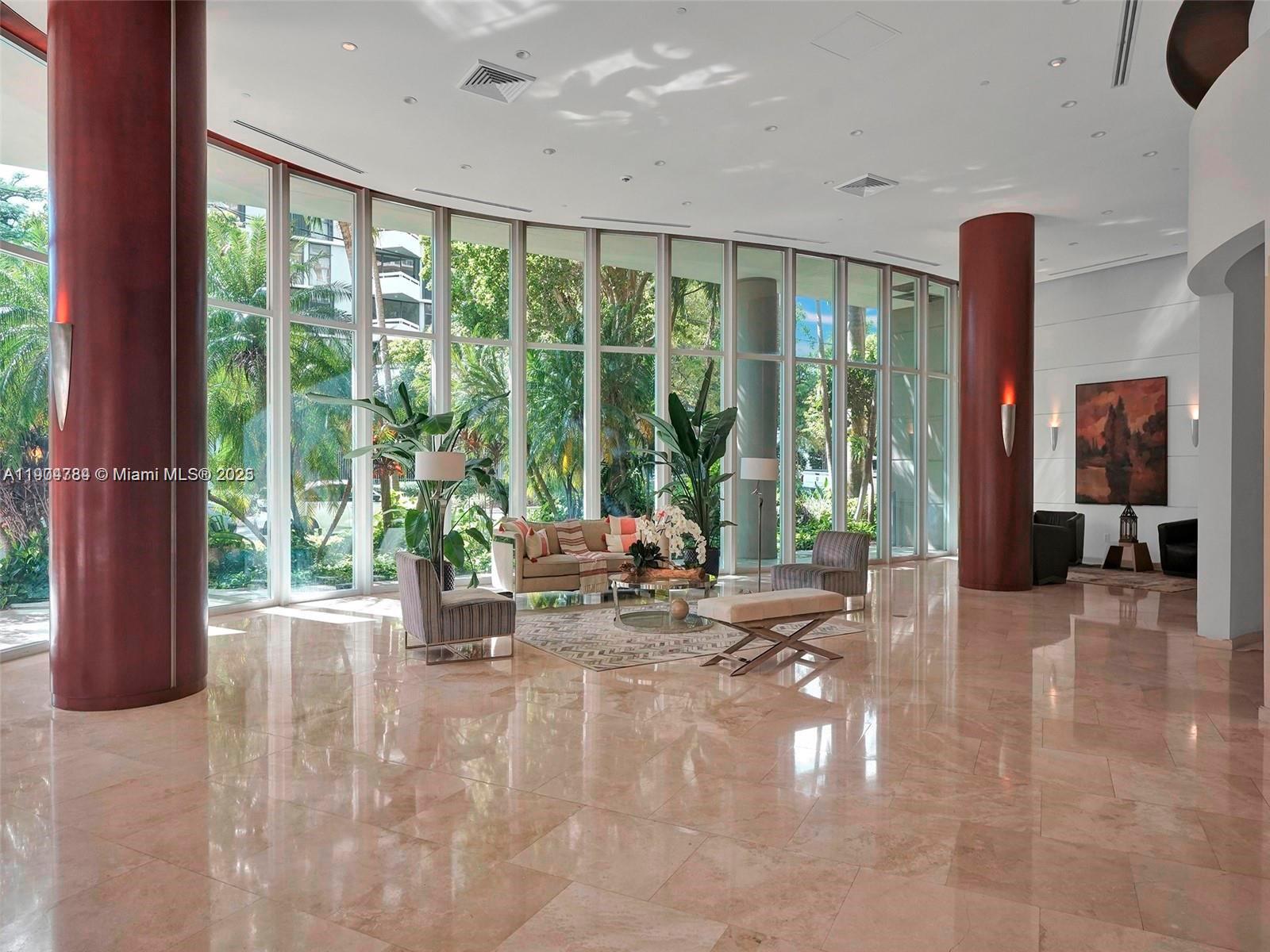 2475 Brickell Avenue, Unit 2006 Miami, FL 33129 - Photo 41 of 61 a lobby with furniture and floor to ceiling window