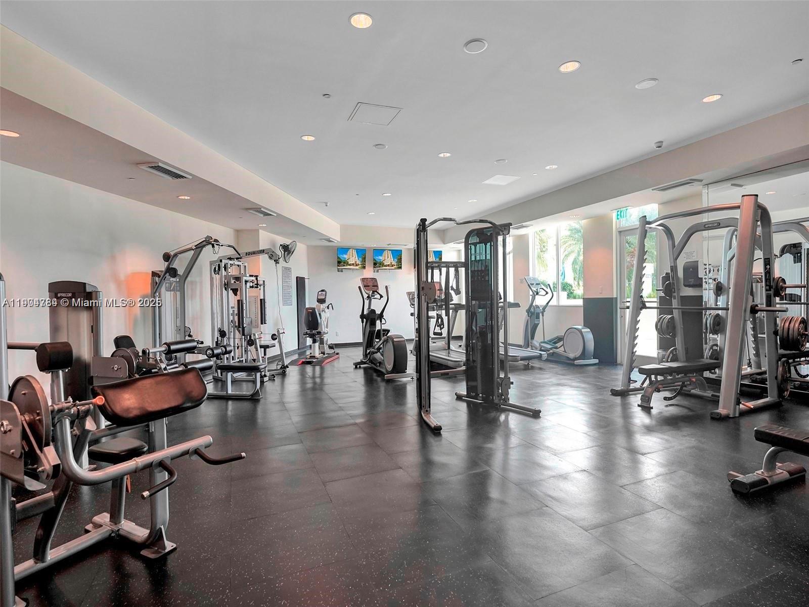 2475 Brickell Avenue, Unit 2006 Miami, FL 33129 - Photo 44 of 61 a view of a room with gym equipment and a large window