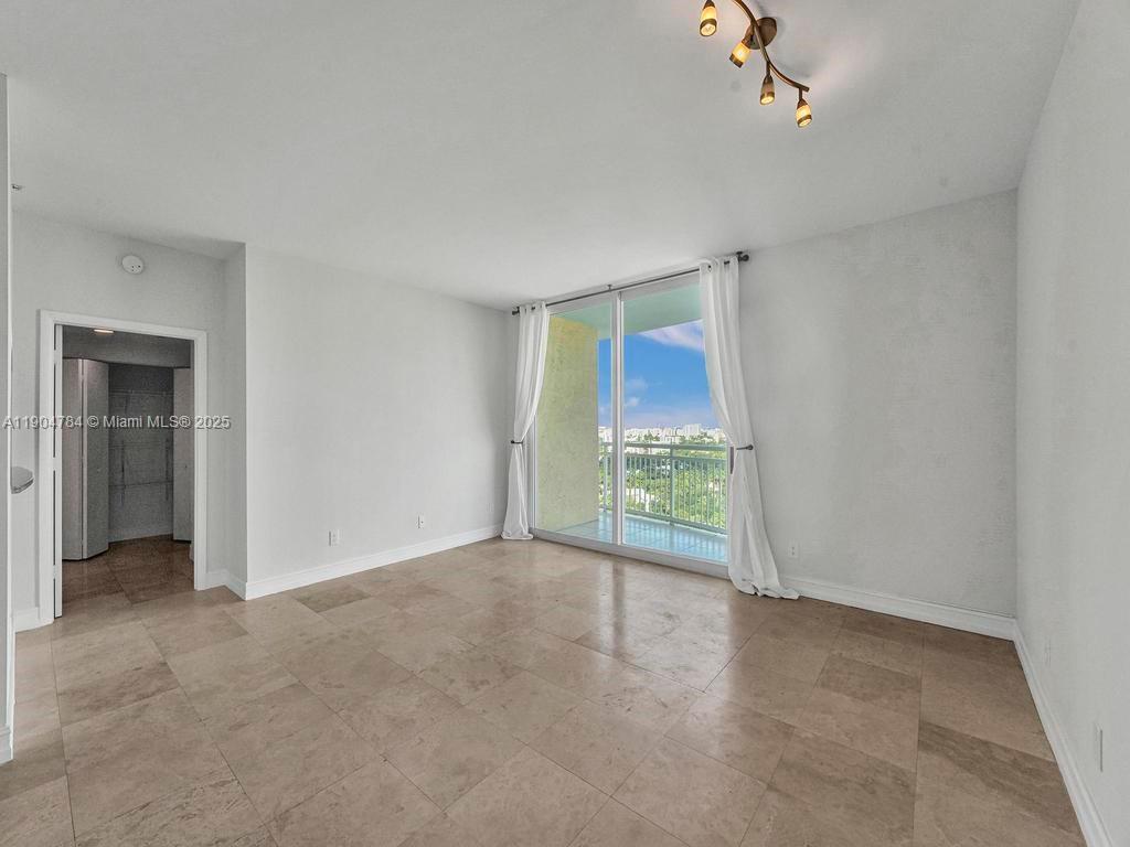 2475 Brickell Avenue, Unit 2006 Miami, FL 33129 - Photo 10 of 61 a view of an empty room with a window