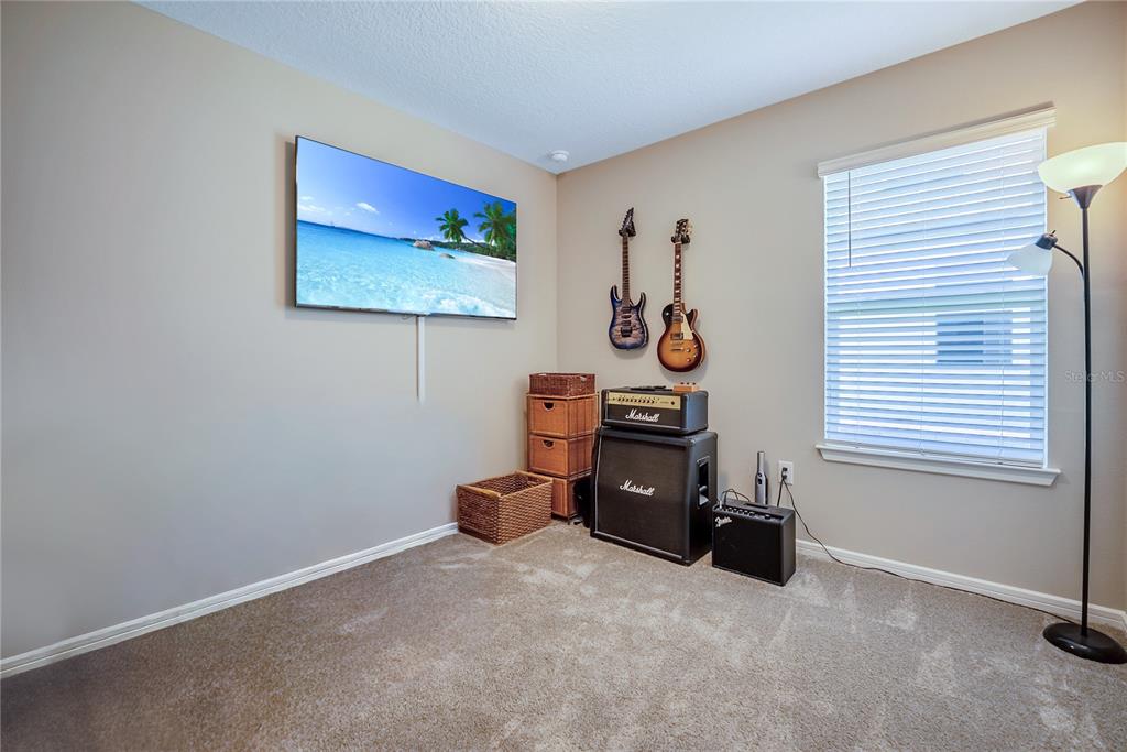 8344 Southwest 54th Loop Ocala, FL 34481 - Photo 18 of 36 an empty room with furniture and a window