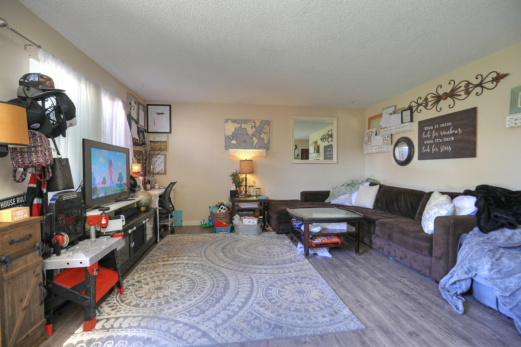 560 South 12th Street Grover Beach, CA 93433 - Photo 18 of 31 a living room with furniture and a flat screen tv