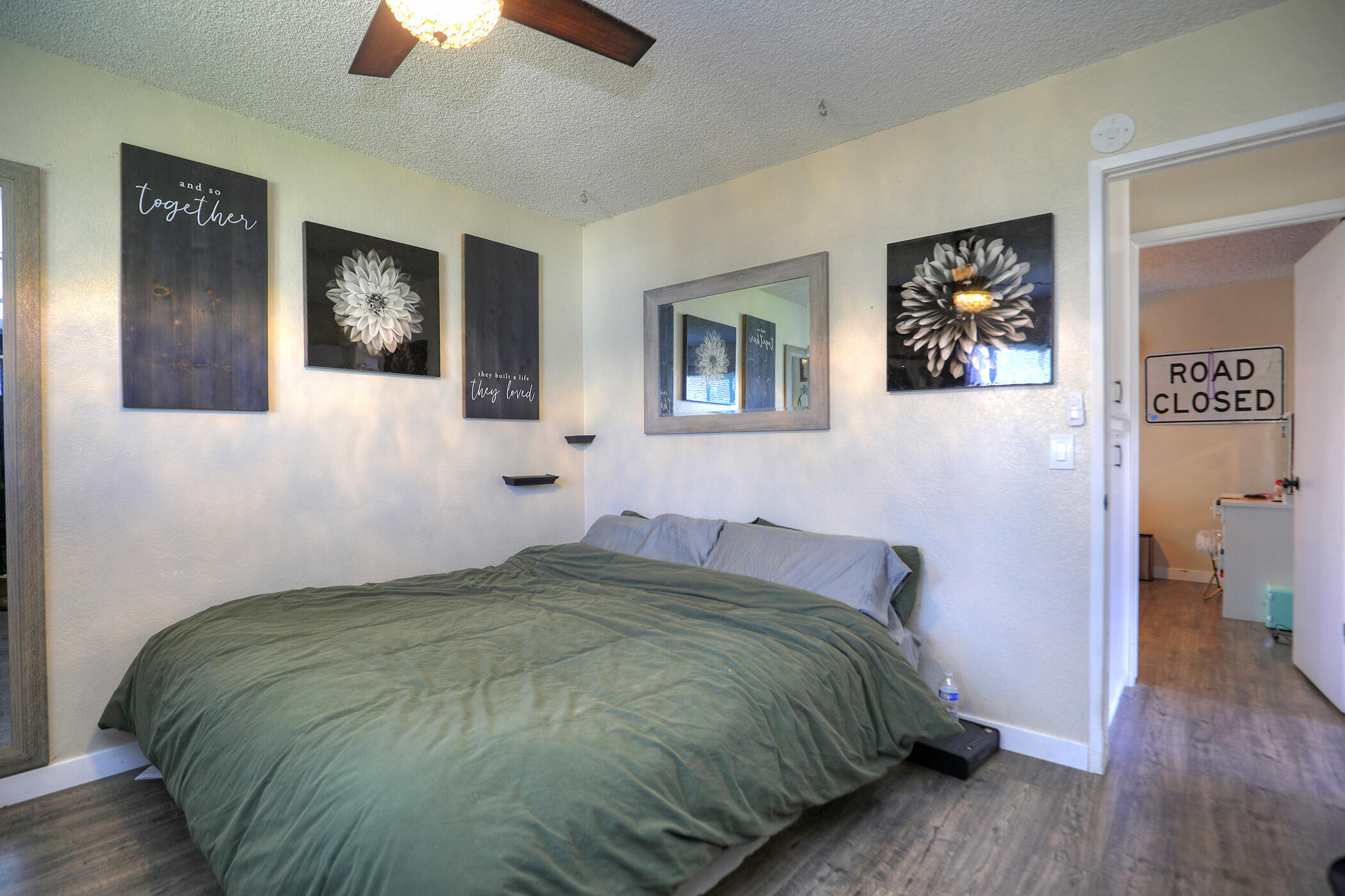 560 South 12th Street Grover Beach, CA 93433 - Photo 23 of 31 a bedroom with a bed and a painting on the wall