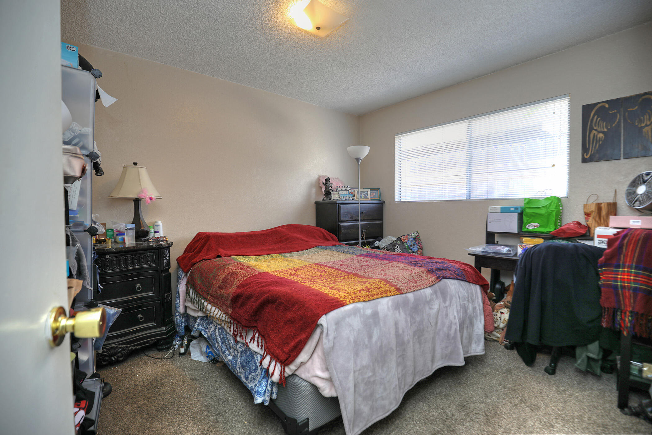 560 South 12th Street Grover Beach, CA 93433 - Photo 9 of 31 a bedroom with a bed and a table chair