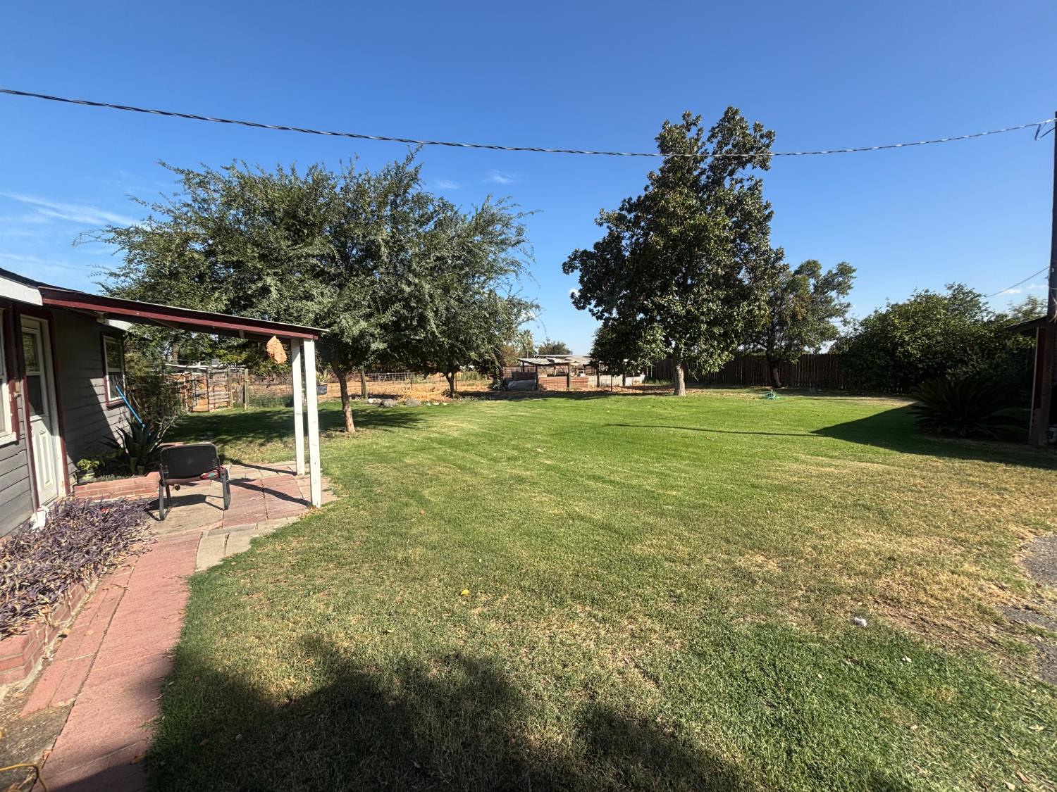 19317 East Parlier Avenue Reedley, CA 93654 - Photo 7 of 36 a view of a swimming pool with a patio