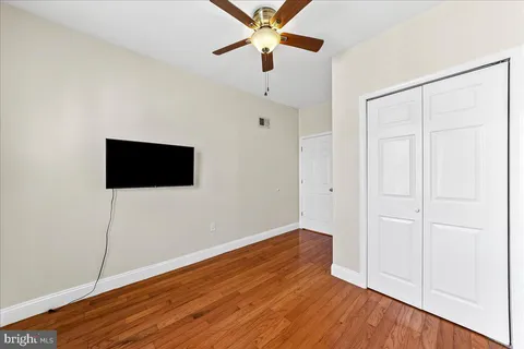 a view of a livingroom with wooden floor