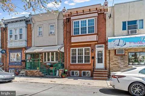 a front view of a building with street view
