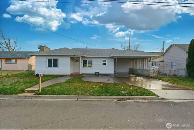 front view of a house with a yard