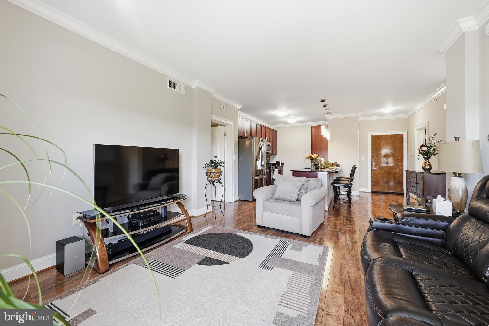 6301 Edsall Road, Unit 519 Alexandria, VA 22312 - Photo 12 of 33 a living room with furniture and a flat screen tv