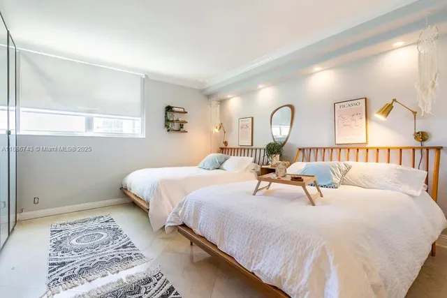 a bed room with a bed and a lamp