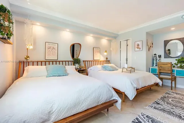 a kitchen with kitchen island a large counter top space appliances and cabinets