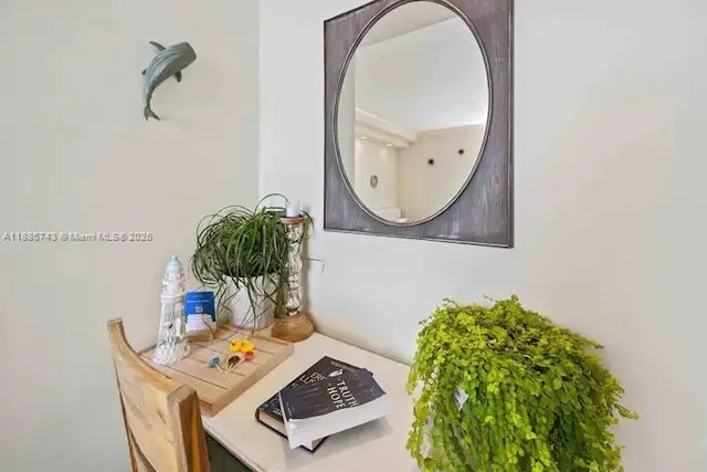 a view of living room kitchen and entryway