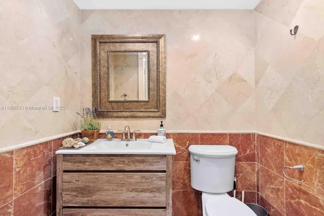 a bathroom with a sink a vanity and a mirror