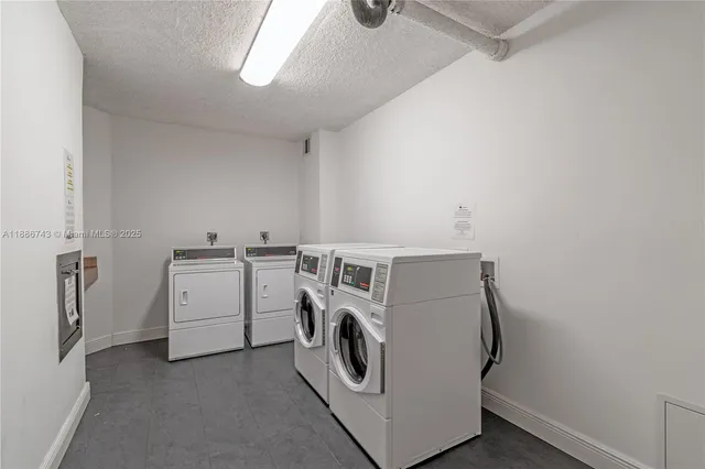a view of swimming pool with seating area and palm tree