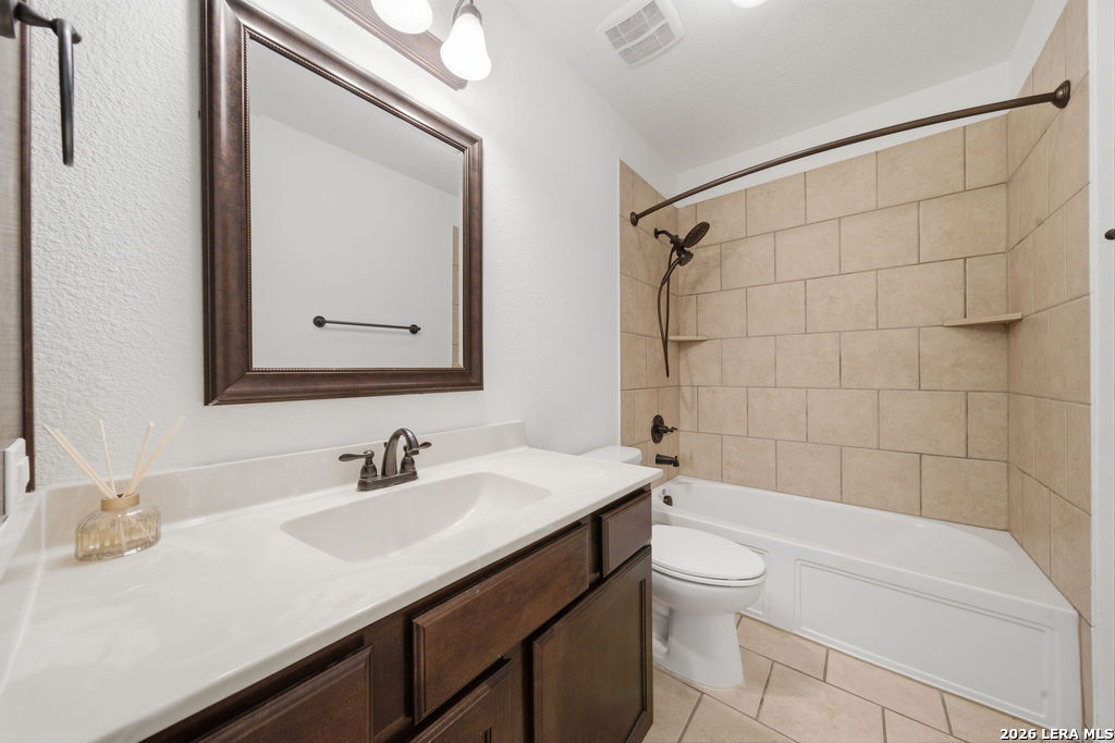 12897 La Vernia Road St. Hedwig, TX 78152 - Photo 27 of 34 a bathroom with a sink a toilet and shower