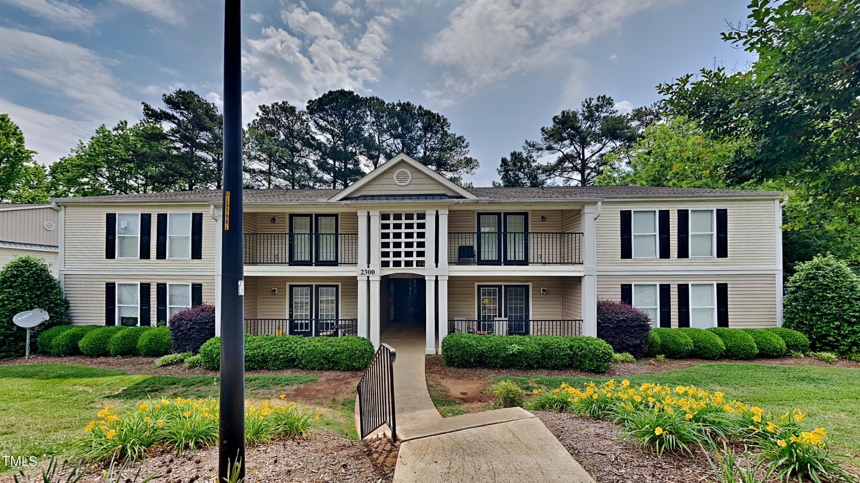 2300 Myron Drive, Unit 3 Raleigh, NC 27607 - Photo 1 of 12 front view of a brick house with a yard
