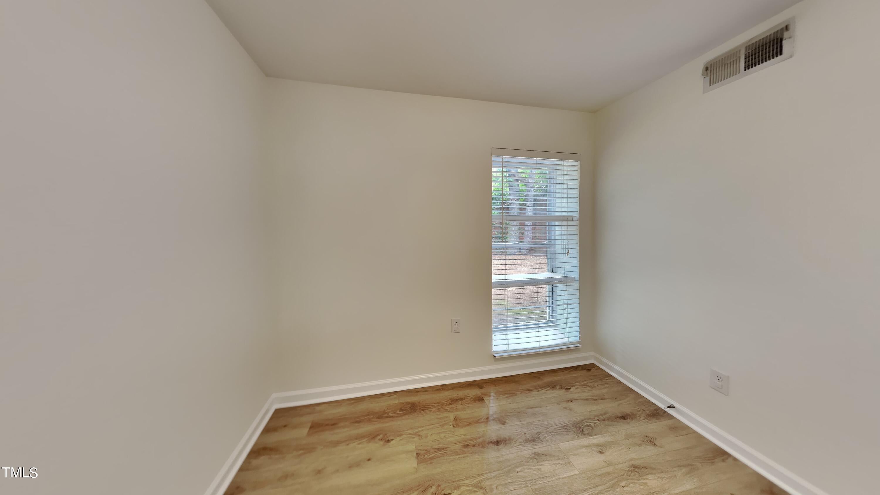 2300 Myron Drive, Unit 3 Raleigh, NC 27607 - Photo 9 of 12 a view of an empty room with a window