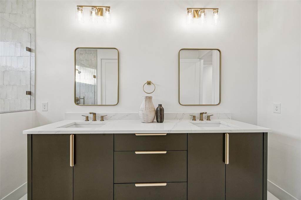 5633 East Side Avenue Dallas, TX 75214 - Photo 12 of 18 a bathroom with a double vanity sink and a mirror