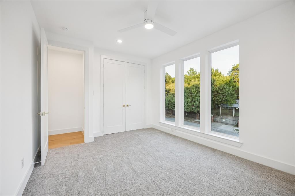 5633 East Side Avenue Dallas, TX 75214 - Photo 15 of 18 a view of an empty room with wooden floor and a window