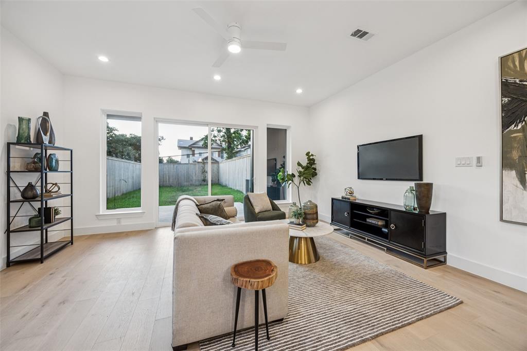 5633 East Side Avenue Dallas, TX 75214 - Photo 6 of 18 a living room with furniture and a flat screen tv