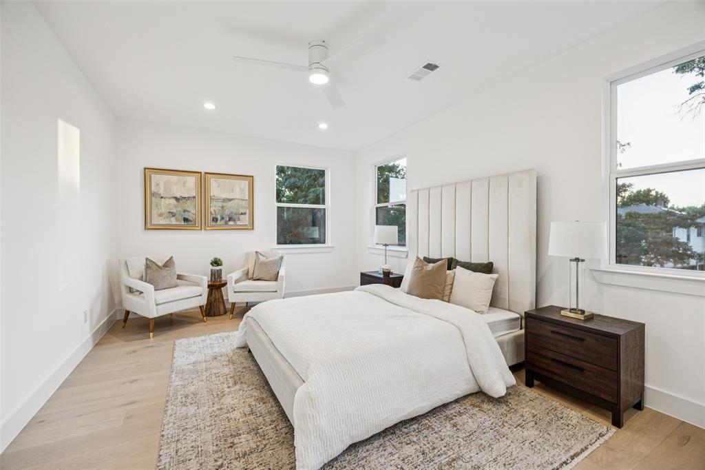 5633 East Side Avenue Dallas, TX 75214 - Photo 9 of 18 a bedroom with two beds and a large window