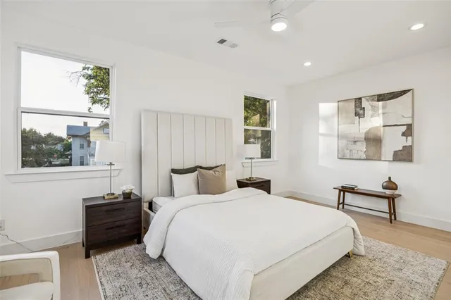 a bedroom with a bed and a window