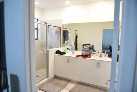 a room with a sink storage and utility