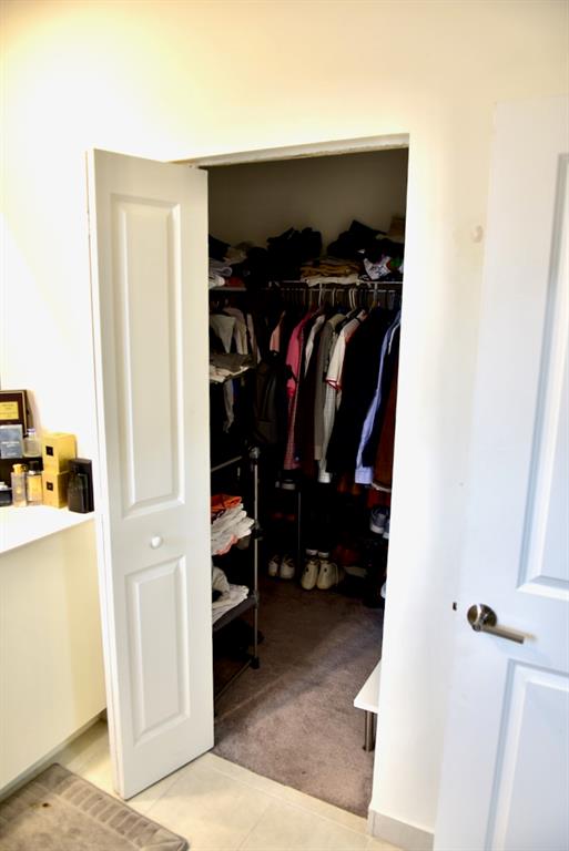 Princeton Homestead, FL 33032 - Photo 20 of 28 a view of walk in closet with clothes and shoes