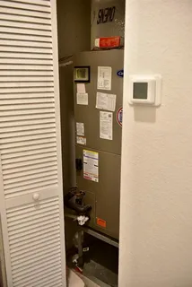 a bathroom with a toilet and a shower curtain