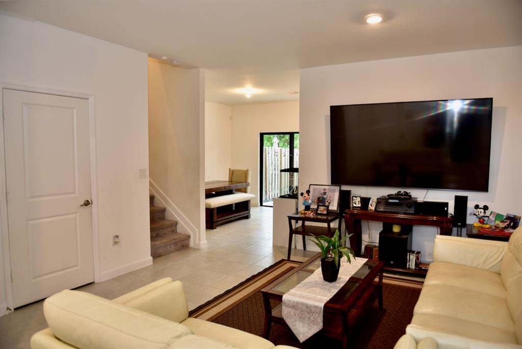 Princeton Homestead, FL 33032 - Photo 4 of 28 a living room with furniture and a flat screen tv