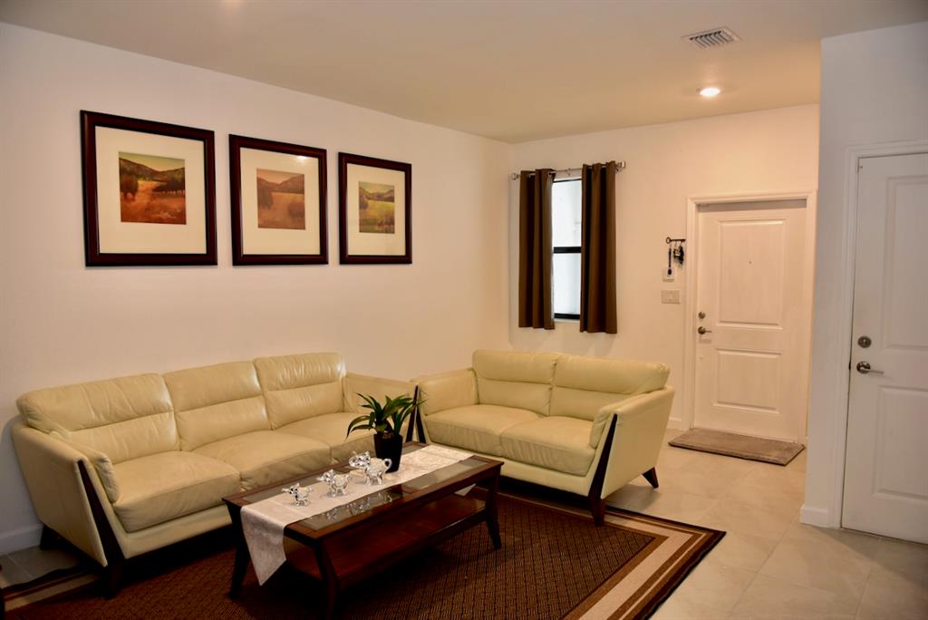 Princeton Homestead, FL 33032 - Photo 5 of 28 a living room with furniture and a window