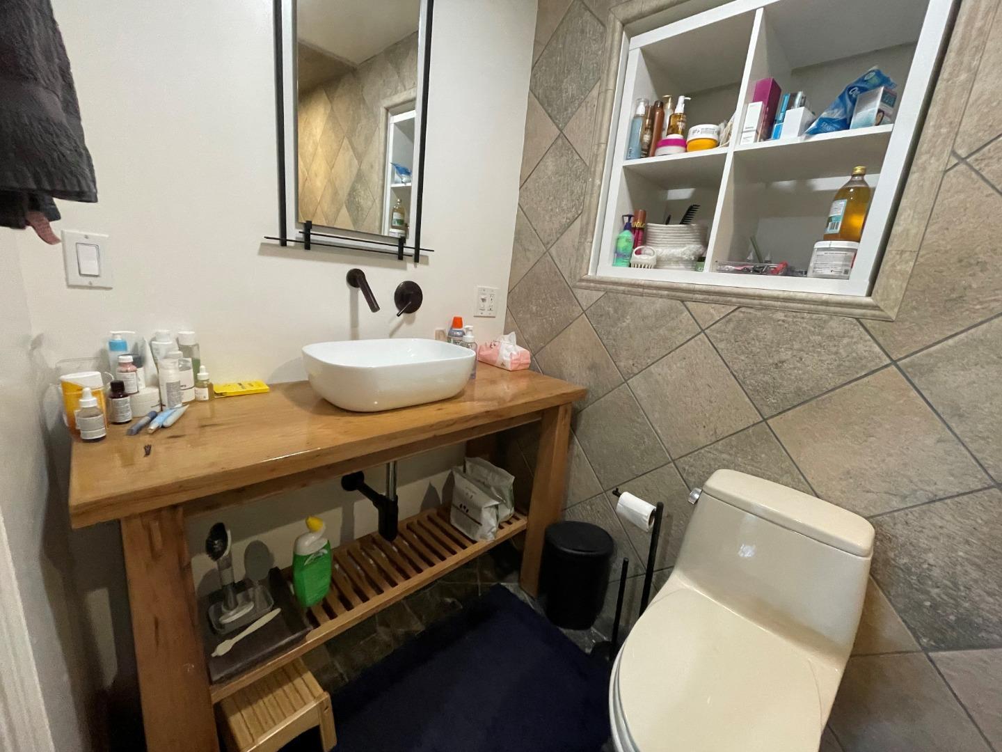 254 Swett Road Woodside, CA 94062 - Photo 18 of 31 a bathroom with a toilet sink and mirror