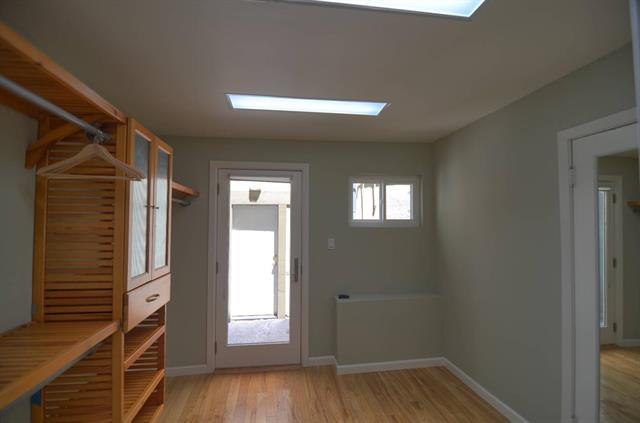 254 Swett Road Woodside, CA 94062 - Photo 21 of 31 a view of an empty room with wooden floor and a window