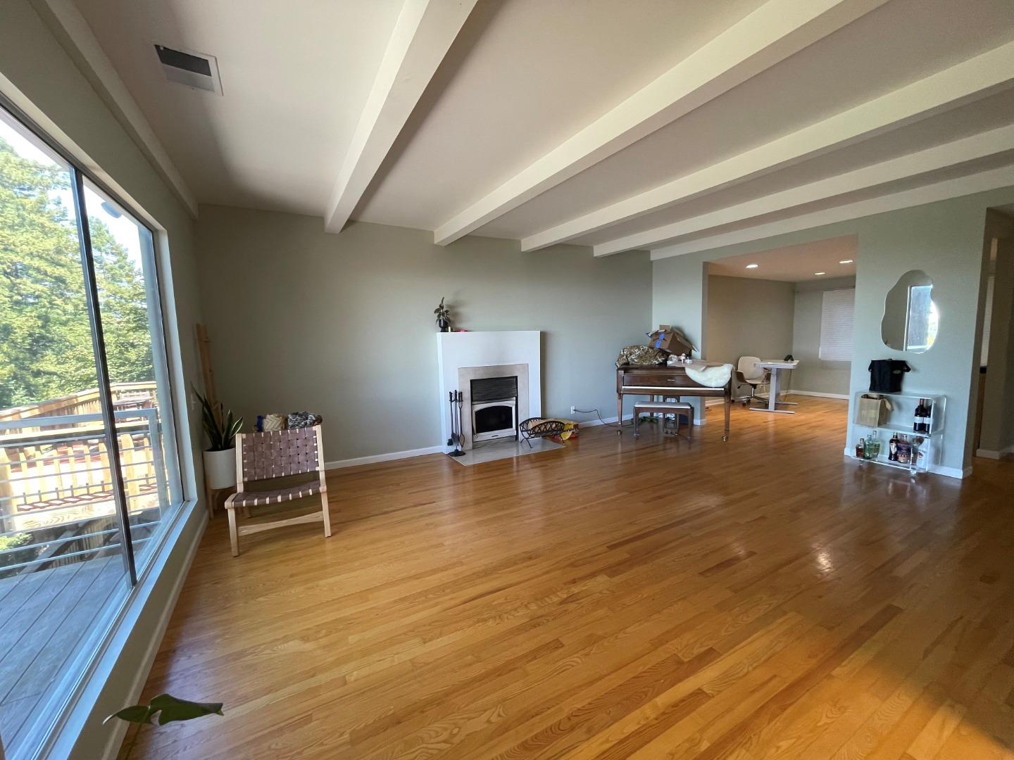 254 Swett Road Woodside, CA 94062 - Photo 7 of 31 a dining room with furniture and wooden floor