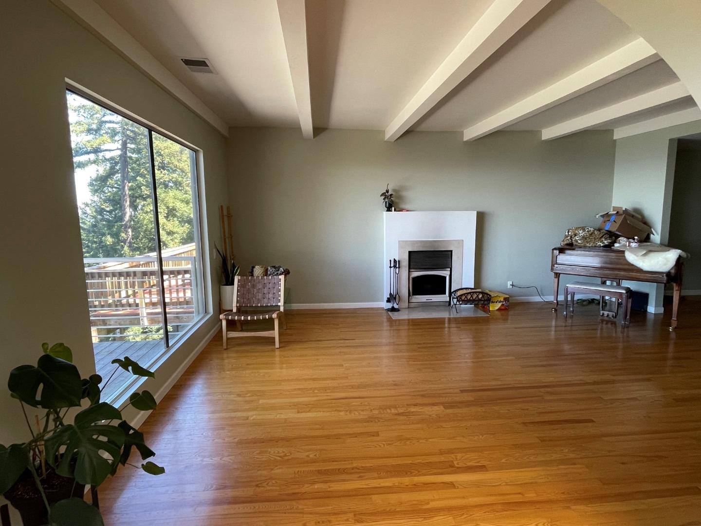 254 Swett Road Woodside, CA 94062 - Photo 8 of 31 a living room with furniture and a fireplace