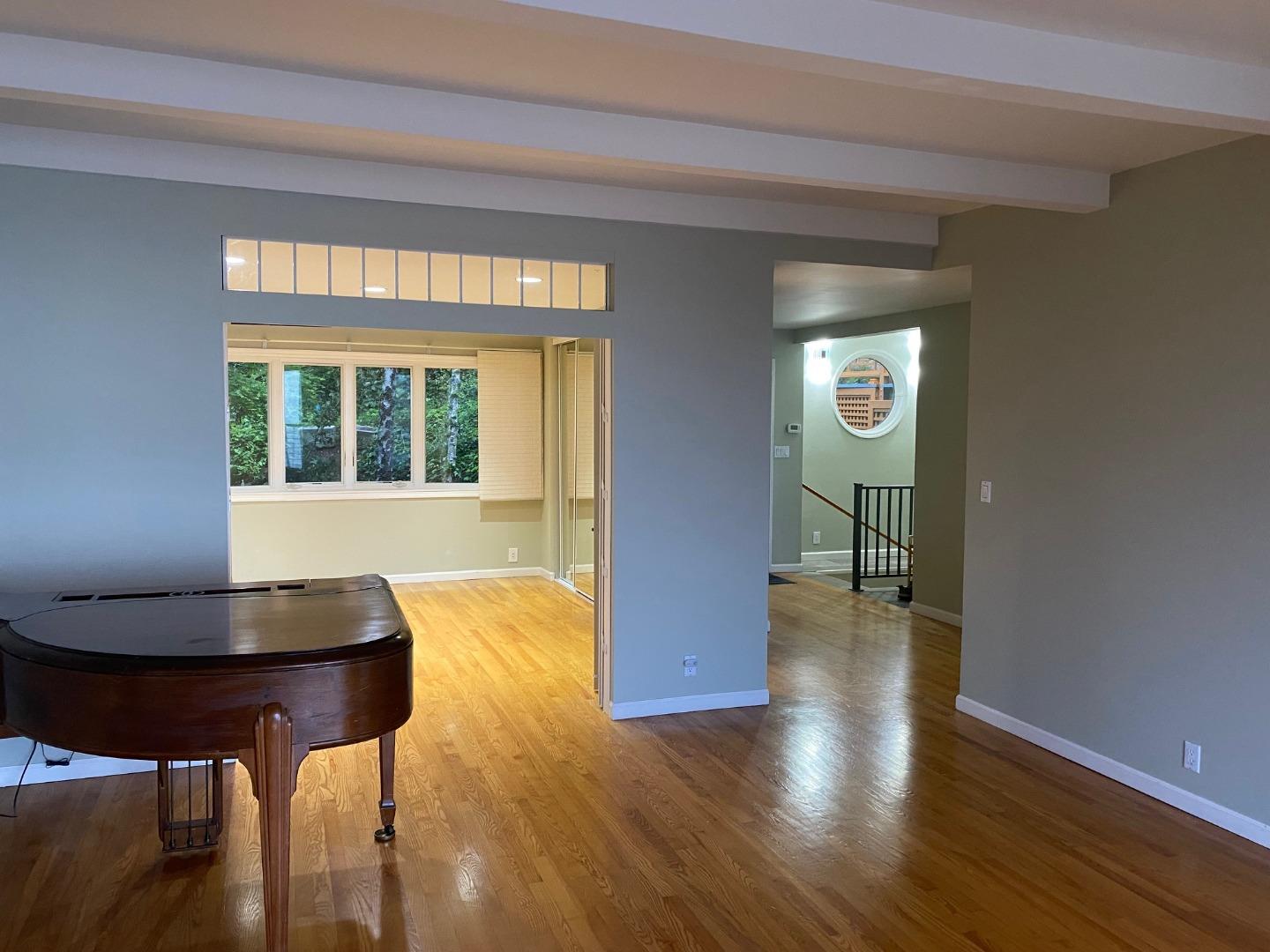 254 Swett Road Woodside, CA 94062 - Photo 10 of 31 a view of a livingroom with furniture and wooden floor