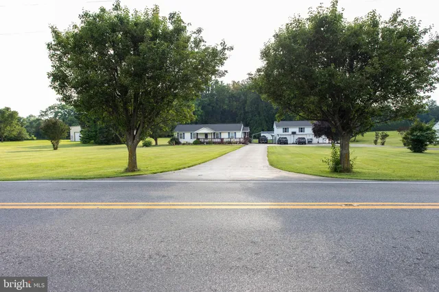 a view of a swimming pool and a yard