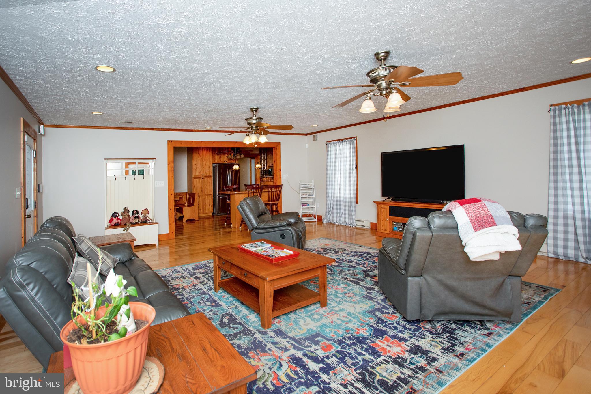 8305 Olivers Shop Road La Plata, MD 20646 - Photo 15 of 43 a living room with furniture a rug and a flat screen tv