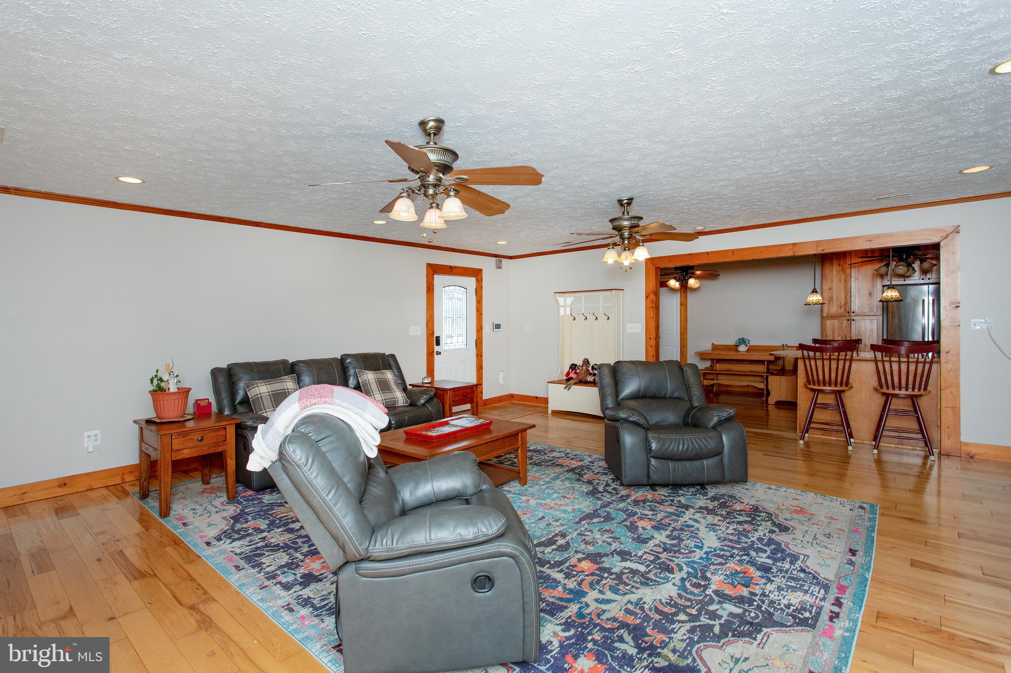 8305 Olivers Shop Road La Plata, MD 20646 - Photo 16 of 43 a living room with furniture a rug and a chandelier