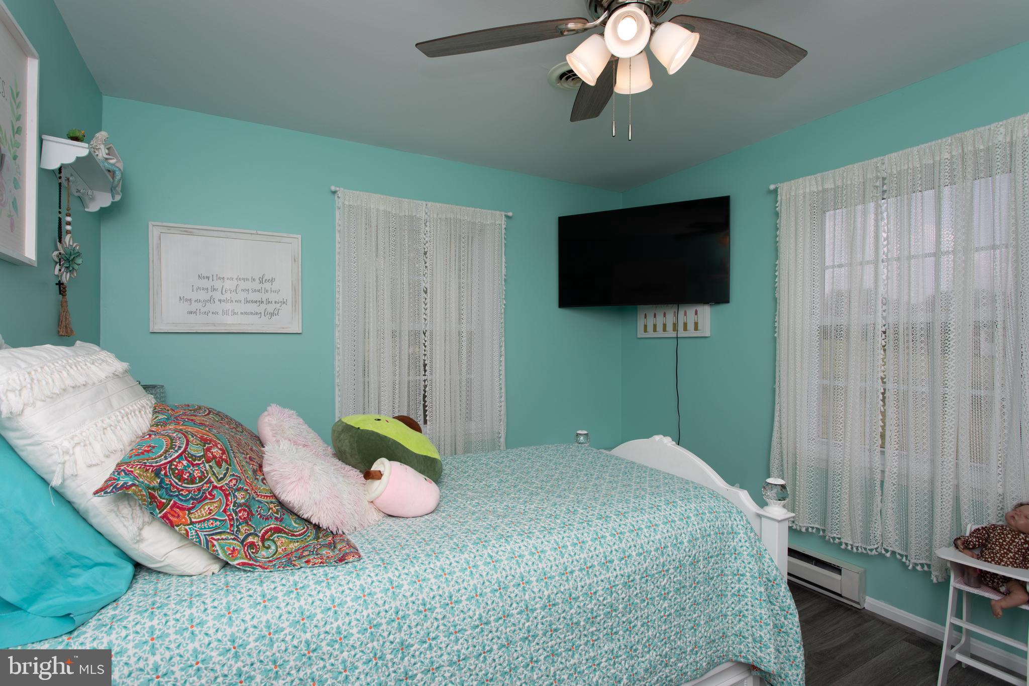 8305 Olivers Shop Road La Plata, MD 20646 - Photo 22 of 43 a bedroom with a bed and a flat screen tv