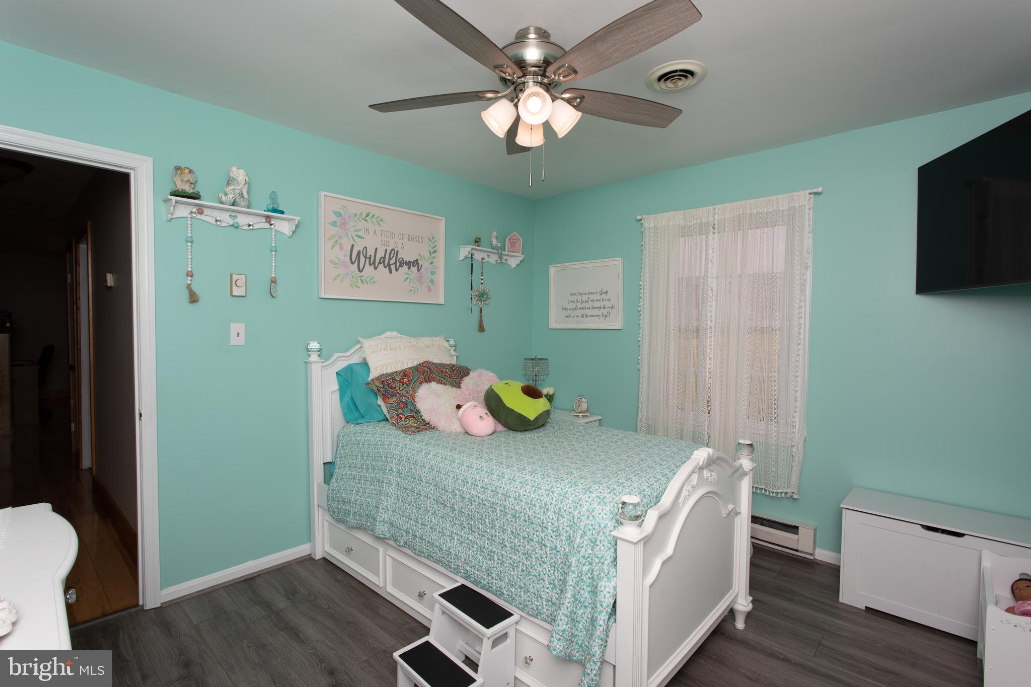 8305 Olivers Shop Road La Plata, MD 20646 - Photo 23 of 43 a bedroom with a bed and a tv