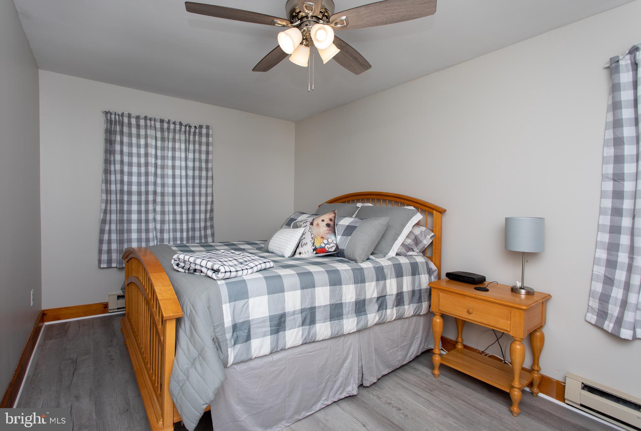 8305 Olivers Shop Road La Plata, MD 20646 - Photo 25 of 43 a bedroom with a bed and wooden floor