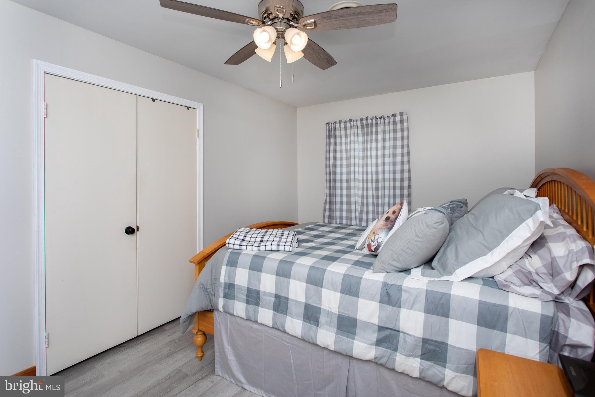 8305 Olivers Shop Road La Plata, MD 20646 - Photo 28 of 43 a bedroom with a bed and wooden floor