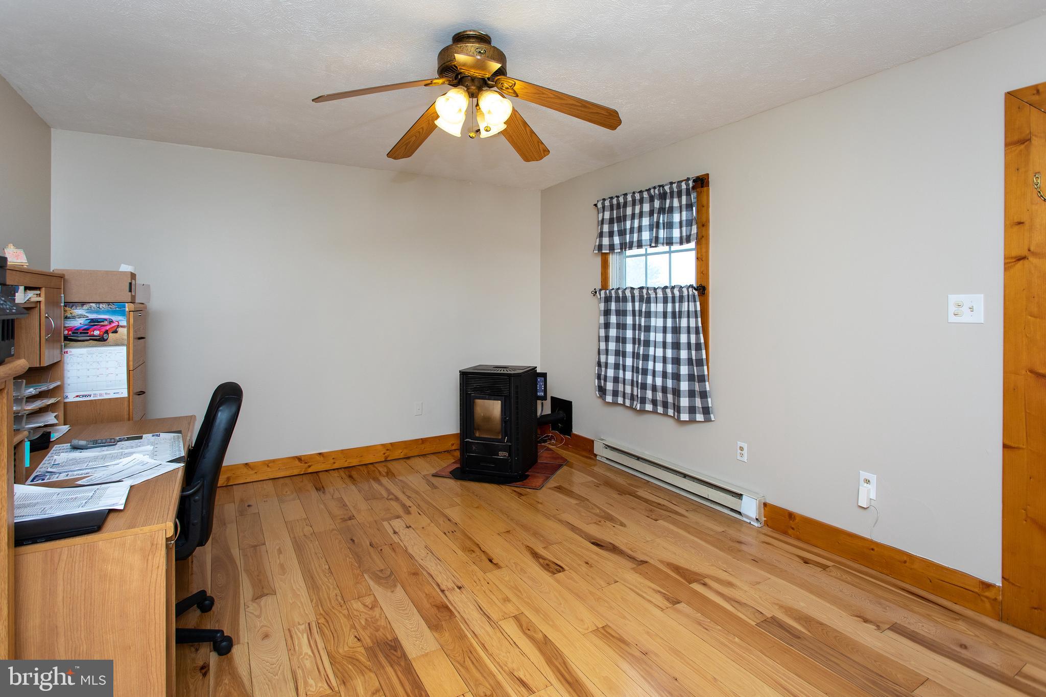 8305 Olivers Shop Road La Plata, MD 20646 - Photo 33 of 43 a bedroom with a bed and a chandelier