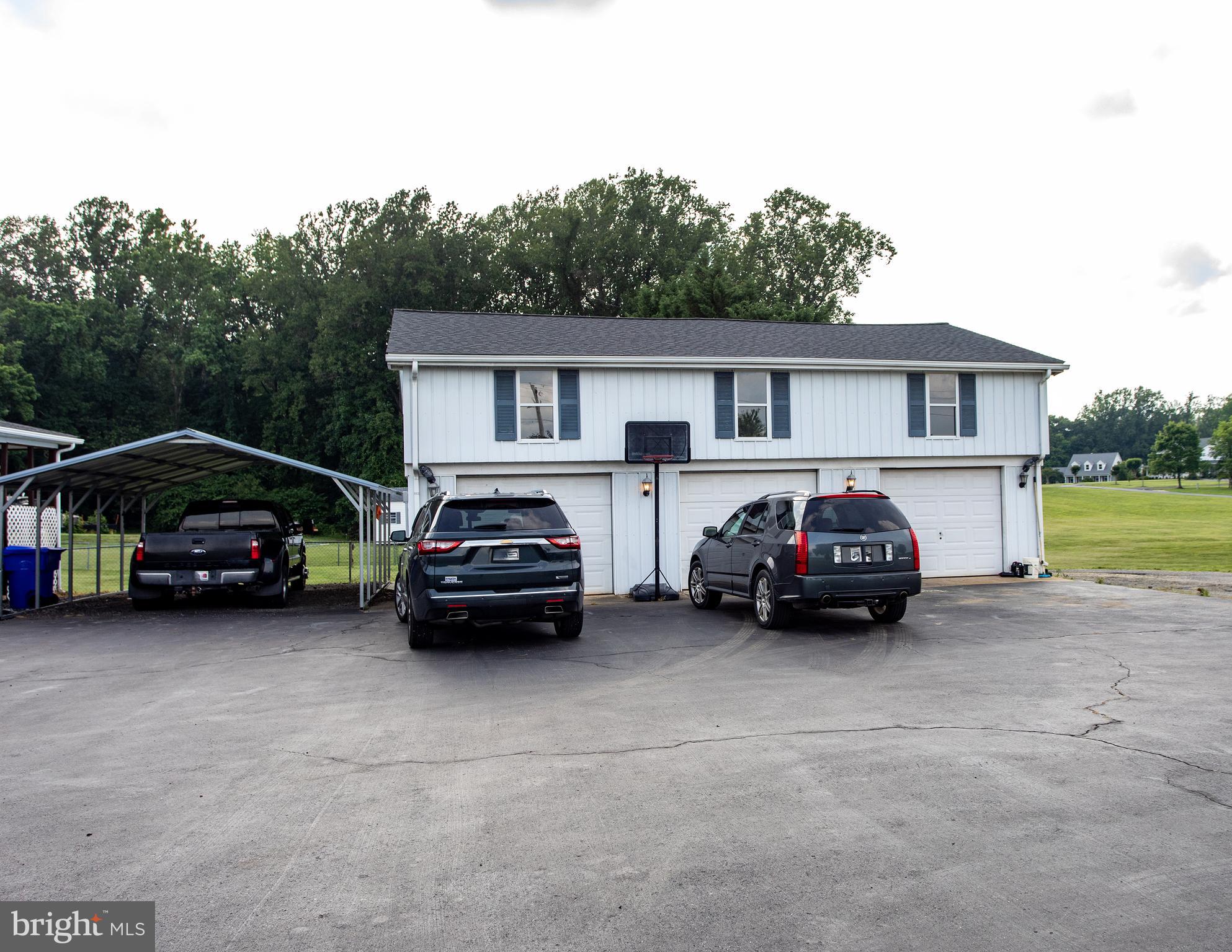 8305 Olivers Shop Road La Plata, MD 20646 - Photo 5 of 43 a car parked in front of a house