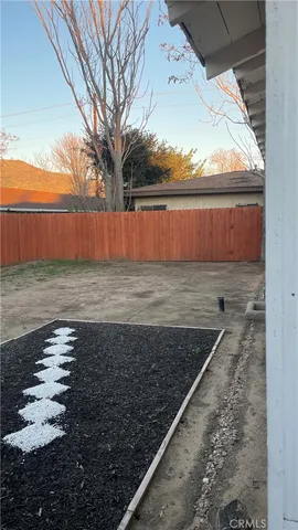 a kitchen with granite countertop a stove and a sink