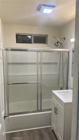 a kitchen with stainless steel appliances wooden cabinets and a counter top space