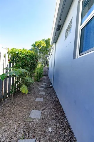 a view of a pathway with plants
