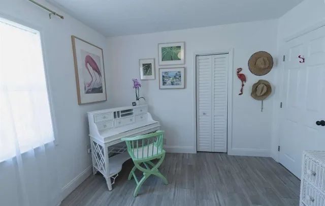 a view of a room that has a table and a chair