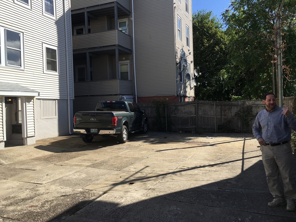 20 Benedict Street, Unit 1F Somerville, MA 02145 - Photo 2 of 12 a view of a house with a yard