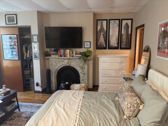 20 Benedict Street, Unit 1F Somerville, MA 02145 - Photo 4 of 12 a bedroom with a bed and a flat screen tv